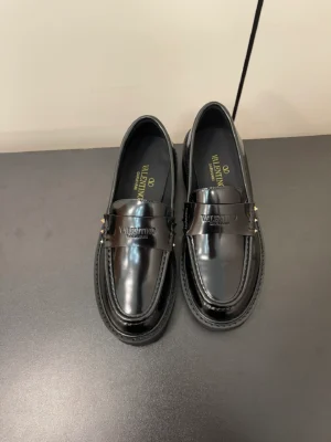 Valentino Garavani VLogo Buckle Leather Loafers – Black